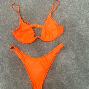 Women bikini. High waisted/cheeky bottom. Never used/NWOT. Size med.